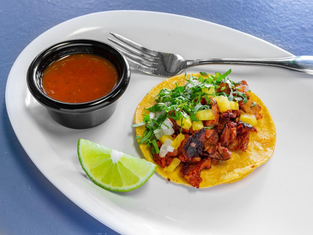 Al Pastor Taco · 1 piece. Marinated pork on a corn tortilla with onions, cilantro, pineapple, and homemade salsa.