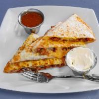 Quesadilla · Comes on flour with cheese, sour cream and homemade salsa. Your choice of protein.