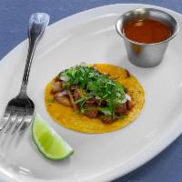 Pork Carnitas Taco · 1 piece. Served on a corn tortilla with onions, cilantro, and homemade salsa.