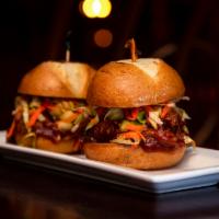Guinness Braised Pork Sliders · Pork shoulder braised with Guinness. Topped with a red cabbage slaw.