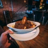Bangers and Mash · Pork sausage with buttermilk mashed potatoes. Served with onion gravy.