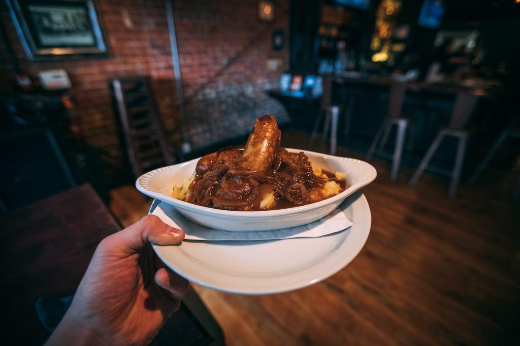 Bangers and Mash · Pork sausage with buttermilk mashed potatoes. Served with onion gravy.