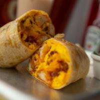 The Chori Burrito · Chorizo roja, tater tots, eggs and cheese in a flour tortilla. Served with a side of fruit.