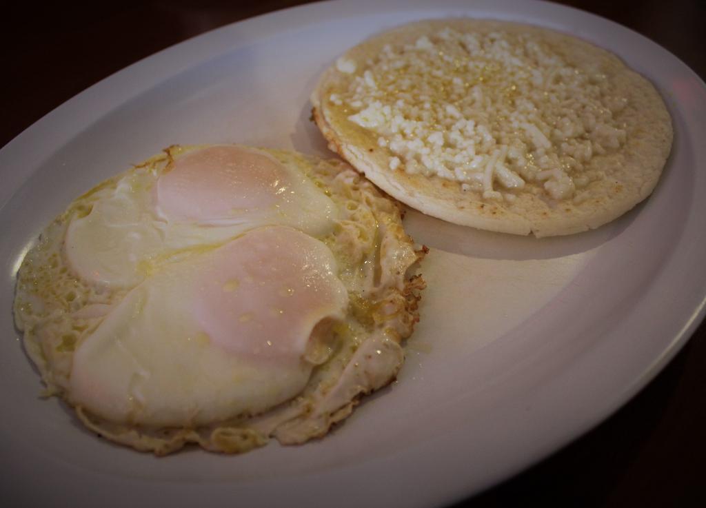 Eggs Breakfast · Served with a corn patty with cheese.