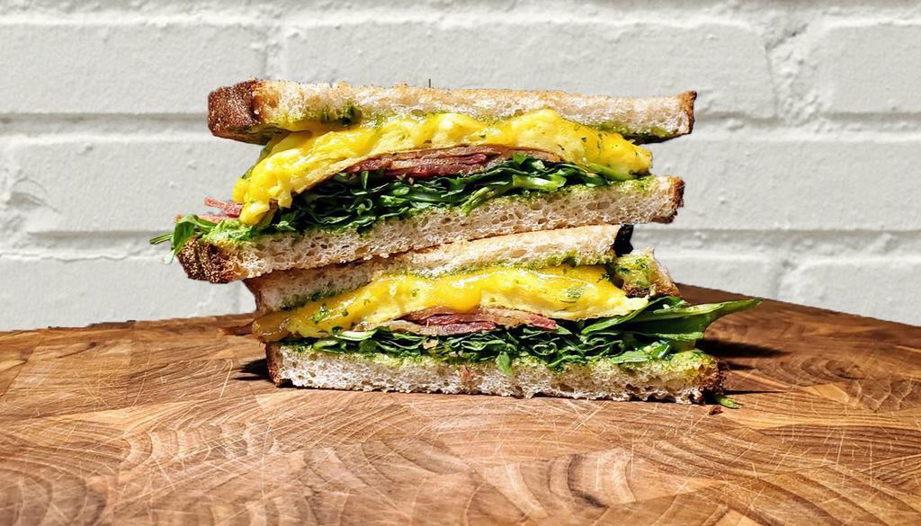 SK8 Sandwich · Sourdough, bacon, cheddar, egg, lemon herb aioli, arugula.