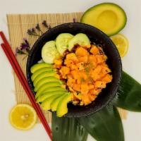 Spicy Salmon Poke Bowl · Sushi rice, antibiotics free salmon, avocado, cucumber, corn, spicy mayonnaise, and unagi sa...
