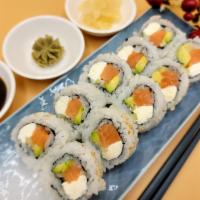 10 Pieces Raw Salmon Philadelphia Roll  · Antibiotics free salmon, cream cheese, avocado, and cucumber. Include natural ginger, natura...