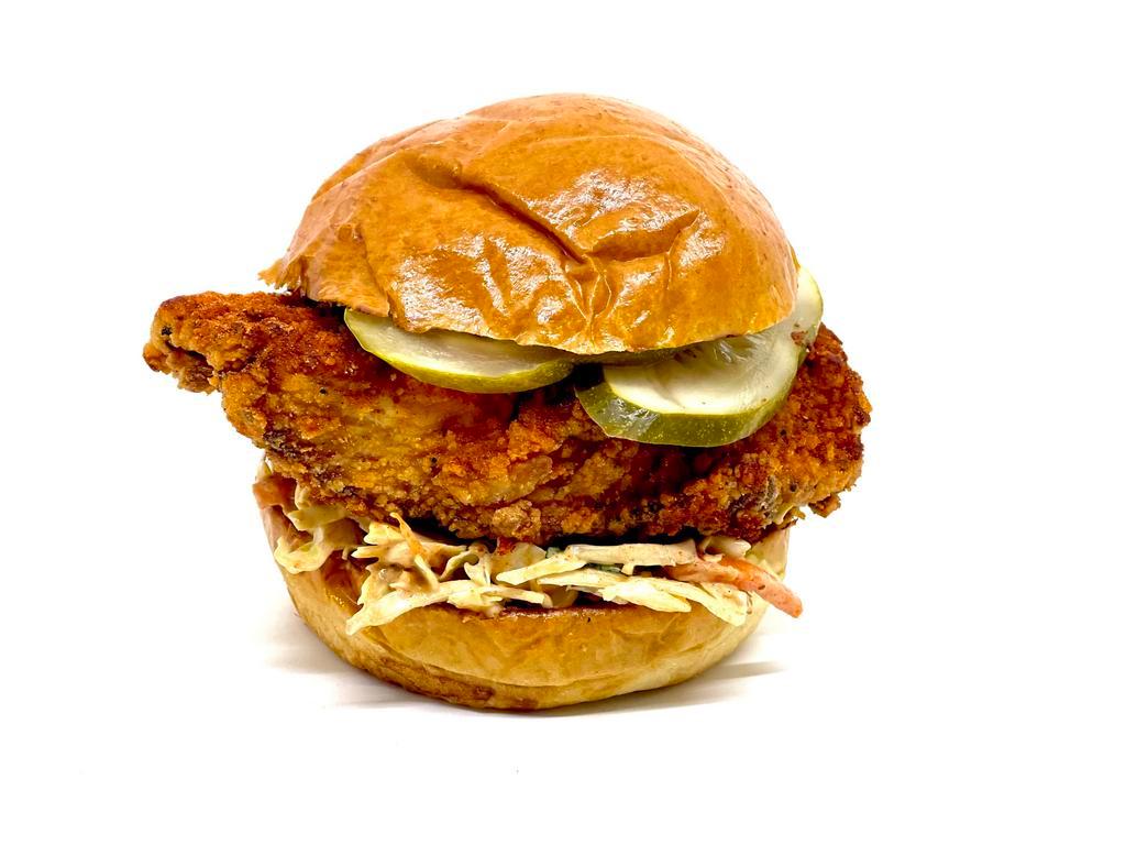 Fried Chicken Sandwich · Choice of hot or mild, pickles, coleslaw, and toasted brioche bun.