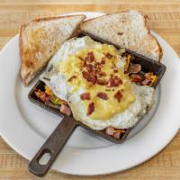 Corned Beef Hash Skillet · Home fries topped with corned beef hash, 2 eggs over easy (or your choice) topped with Holla...