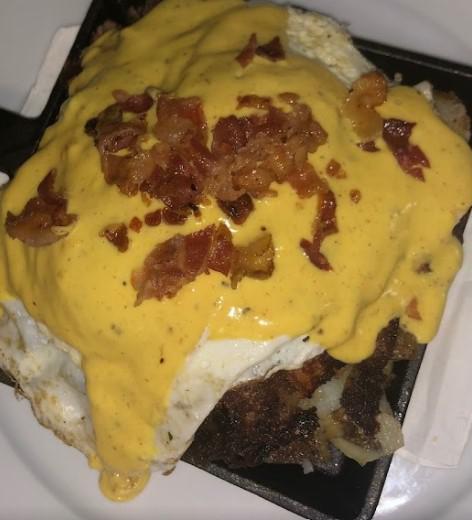 Ham and Cheese Skillet · Home fries, peppers and onions with ham, cheddar cheese and two eggs over easy (or your choice) with Hollandaise sauce. Choice of toast.