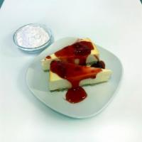 New ++ Strawberry cheesecake++ · A slice of cheesecake with a strawberry topping.