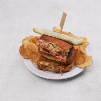 Cubano Sandwich · BBQ pulled pork, honey smoked ham, Swiss cheese, yellow mustard and dill pickles on toasted ...