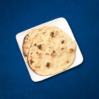 Tandoori Roti(Vegan) · Whole wheat flat bread baked to perfection in an Indian clay oven
