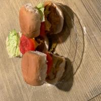 Smoked Turkey Sliders  · Delicious smokey sliders topped with lettuce, tomato, and grilled onions.