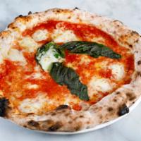 Margherita Pizza · Tomato sauce, fior di latte mozzarella, extra virgin olive oil and basil.