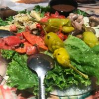 Garden Salad · Iceberg lettuce, cucumber, tomatoes, carrots, Kalamata olives, pepperoncinis and onions with...