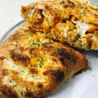 Buffalo Chicken Calzone · Breaded chicken dipped in hot sauce, blue cheese and mozzarella. Served with a side of marin...