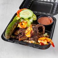 7. Carne Asada Special · Steak server with rice,beans salad 
Jalapenos and 3 tortillas