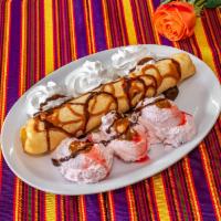 Banana Chimichanga · Sweet banana wrapped in a flour tortilla, deep fried, topped with honey and cinnamon, vanill...