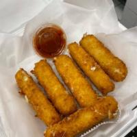 Homemade Mozzarella Sticks · Hand-breaded mozzarella sticks fried and marinara sauce served on the side.