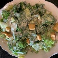 Caesar Salad · Romaine lettuce tossed in Caesar dressing topped with croutons. Add chicken for an additiona...