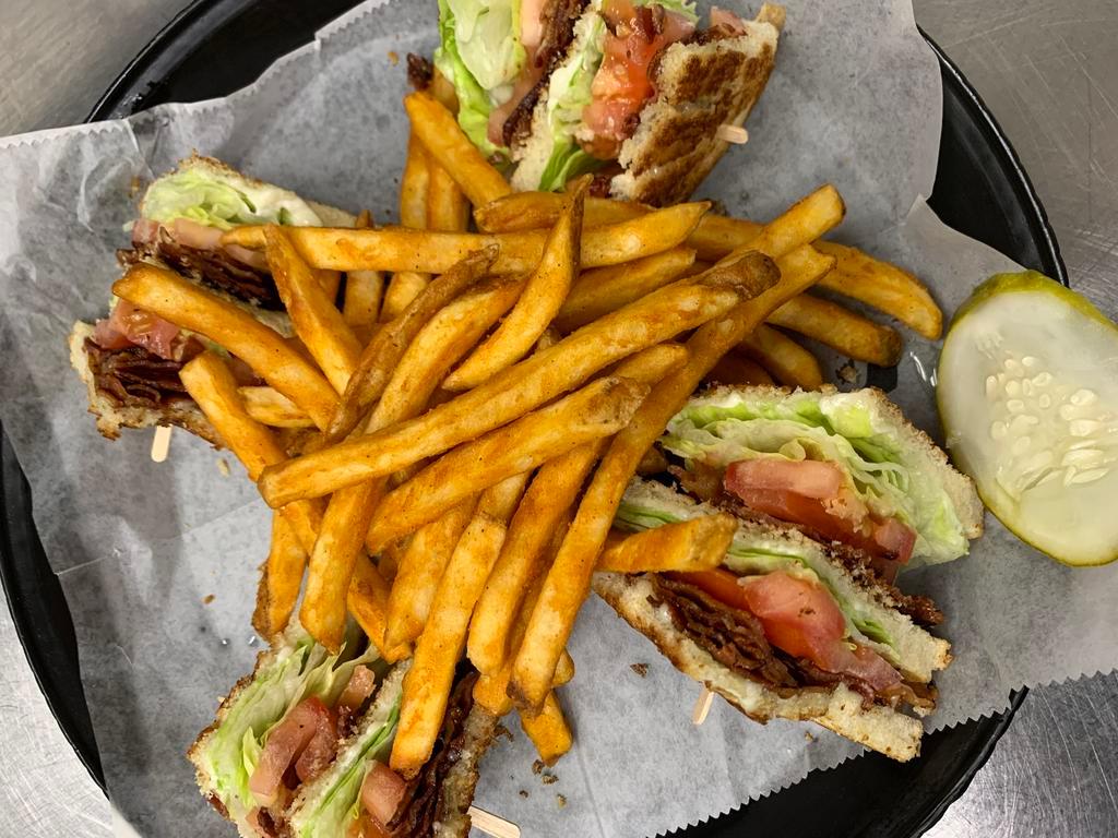 B.L.T. Club · Triple Decker sandwich served on white or wheat toast topped with crispy bacon, lettuce, tomatoes, and mayo. Add avocado for an additional charge.
