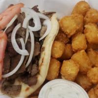 Gyros Sandwich · Gyros meat grilled to perfection. Served on pita bread topped with onions and tomatoes with ...