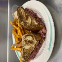 Corned Beef Sandwich · Thinly sliced corned beef served on rye bread served with raw horseradish served on the side...