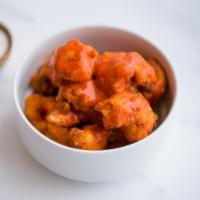 Signature Gluten-Free and Vegan Buffalo Cauliflower Wings · Our signature cauliflower wings tossed in our buffalo sauce with house-made vegan ranch dres...
