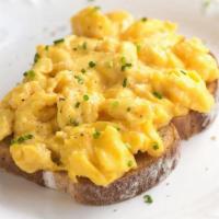 Revuelto on a Toast  · A 3 scrambled egg with a multigrain toast. Add ons for an additional charge. 
