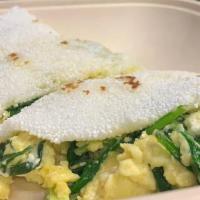 Tapioca Scrambled Eggs, Feta and Spinach  · Typical Brazilian tortilla made with yuca starch filled with scrambled eggs, spinach and fet...