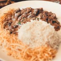 Beef Strogonoff · Beef strogonoff with mushrooms. Served with white rice and shoestring potato. 