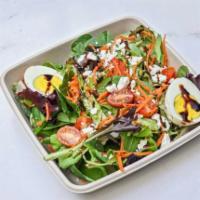 House Salad · Spring mix, tomato, onion, carrot, egg, feta cheese and balsamic glaze.