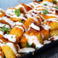Bacon Ranch Loaded Tots · Ranch seasoned tater tots, cheddar, loads of bacon, ranch drizzle, topped with chives