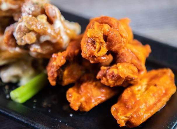 12 Traditional Wings · 12 traditional wings, choice of up to 2 sauces or dry rubs