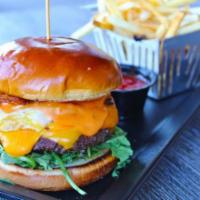 Stout Royale Burger · fried egg • bacon • cheddar • american • tomato • arugula • extra 1000 island