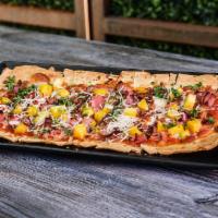 Hawaiian Pig Pizza · pineapple • ham • bacon • mozzarella •
pizza sauce • parsley