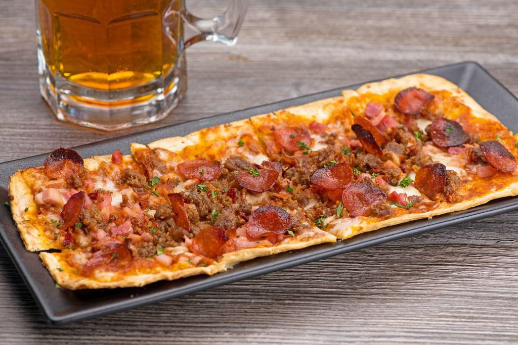 Carnivore Pizza · pepperoni • spicy sausage • ham • bacon •
mozzarella • pizza sauce