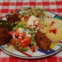 Mediterranean Platter · A sampler plate consisting of hummus, babaganush, tabouli, Mediterranean salad, dolmas, ezme...
