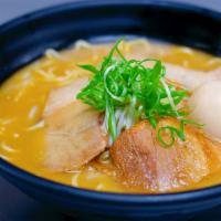 Rich Garlic Ramen · Mix of seafood and pork bone broth with fresh ground garlic, topped with bean sprouts, egg, ...
