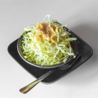 Salad · Finely shredded cabbage served with house creamy ginger dressing.