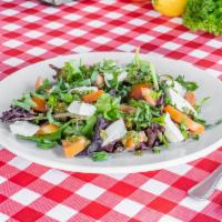 Caprese Salad · Mixed greens, fresh basil, tomatoes, fresh mozzarella and balsamic vinegar.