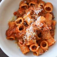 Rigatoncini al  Bolognese Classico  · Pork and Beef Bolognese with Tomato, Parmigiano, Pecorino,
Sage & Rosemary ;
Allergens: Glut...