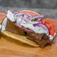 Gyros Sandwich · Delicious Gyros meat cooked on a spit and wrapped in a pita with our housemade Gyros Sauce (...