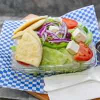 Greek Salad · Our delicious salad MADE DAILY: Bed of lettuce, tomatos, green peppers, onions, cucumbers, F...