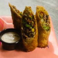 Jerk Chicken Spring Rolls  · Chicken, cabbage, corn, carrots entwined in egg roll wrap and deep fried. Served with jerk m...