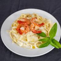 2. Fettuccine Alfredo · An Italian classic served with our housemade Alfredo cream sauce. Served with our house brea...