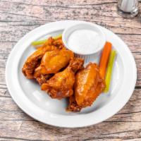 Bottleship Wings · Jumbo party wings fried to perfection. Tossed in your choice of hot, mild, lemon pepper, bar...