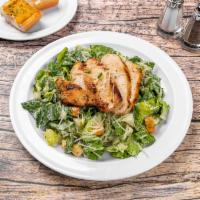 Chicken Caesar Salad · Romaine lettuce, Parmesan cheese and seasoned croutons tossed in Caesars dressing topped wit...