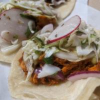 Chicken by the Pound · A pound of our slow cooked chicken.  Comes with warm tortillas, our signature citrusy slaw a...